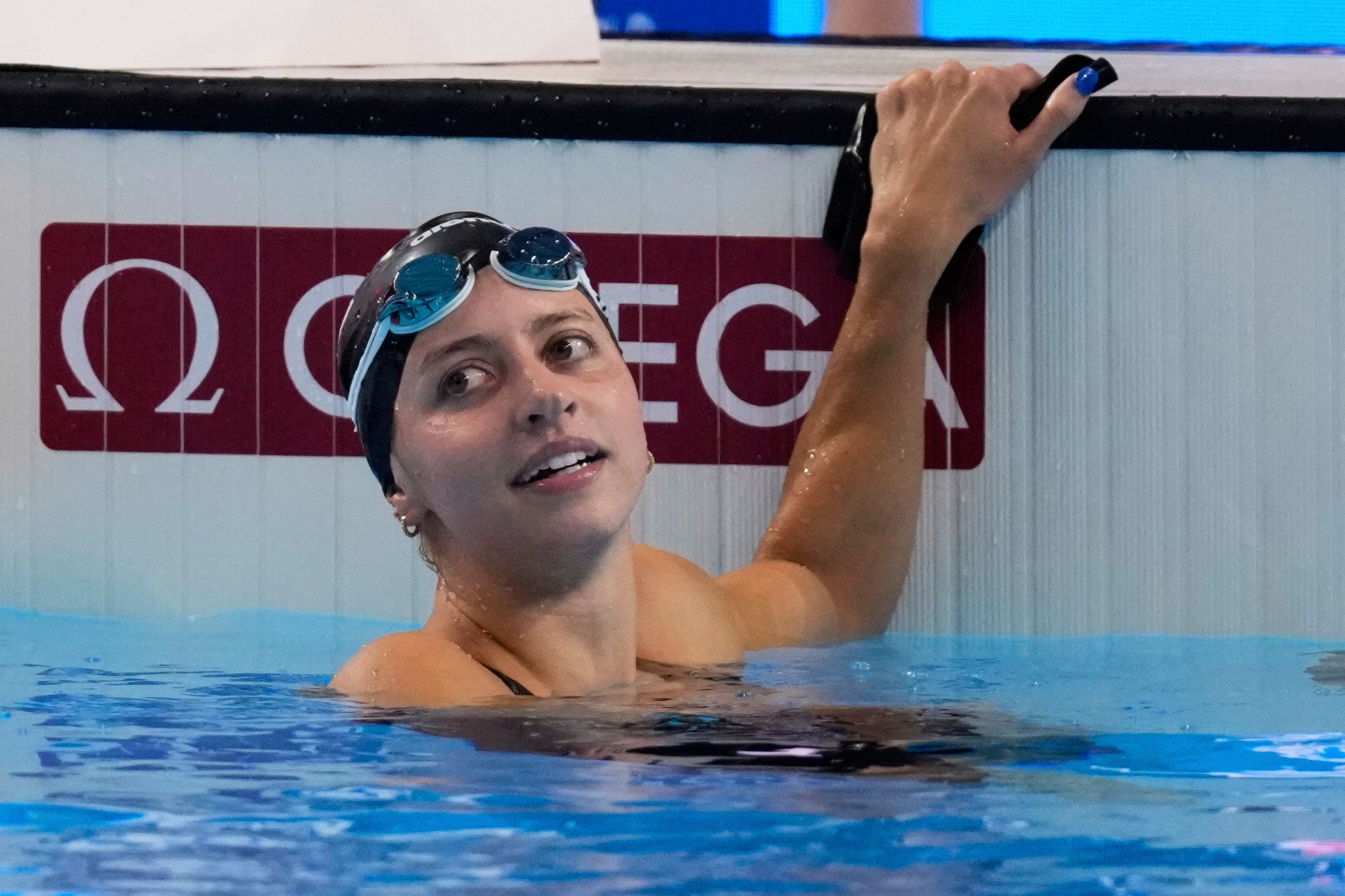 FILE -Kate Douglass of the United States reacts after winning gold medal in the women's 200-meter breaststroke final at the World Aquatics Championships in Singapore, Friday, Aug.1, 2025.