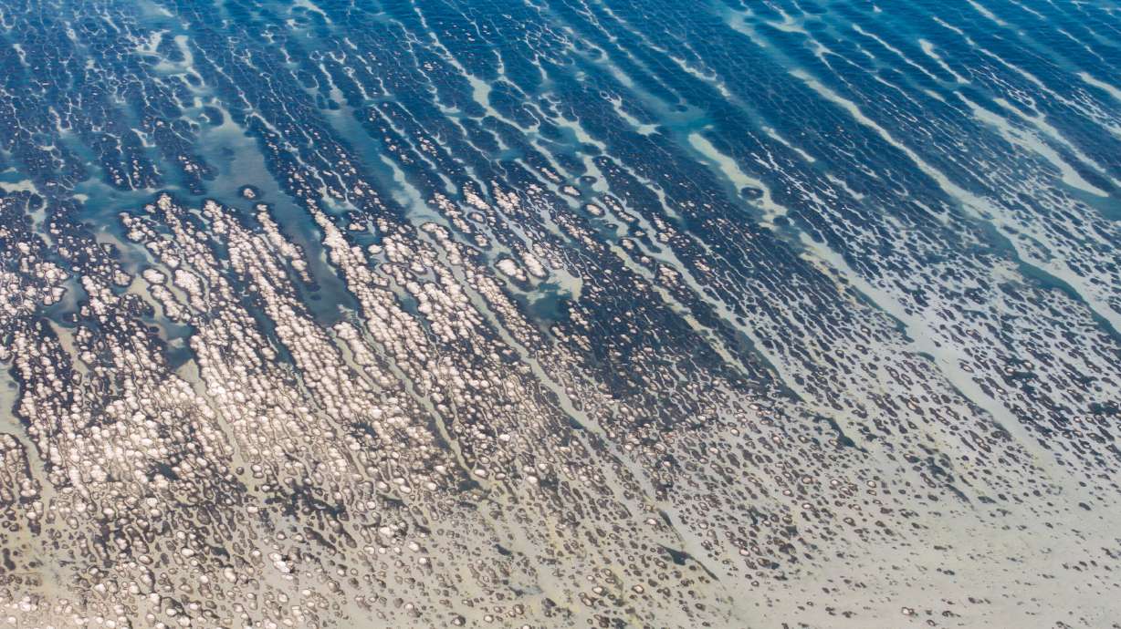 Patterns of water and the ground are pictured at the edge of the Great Salt Lake in Salt Lake City on June 4. A recent study found nearly 70% of Salt Lake County residents are considered by the declining lake, but some groups more than others.