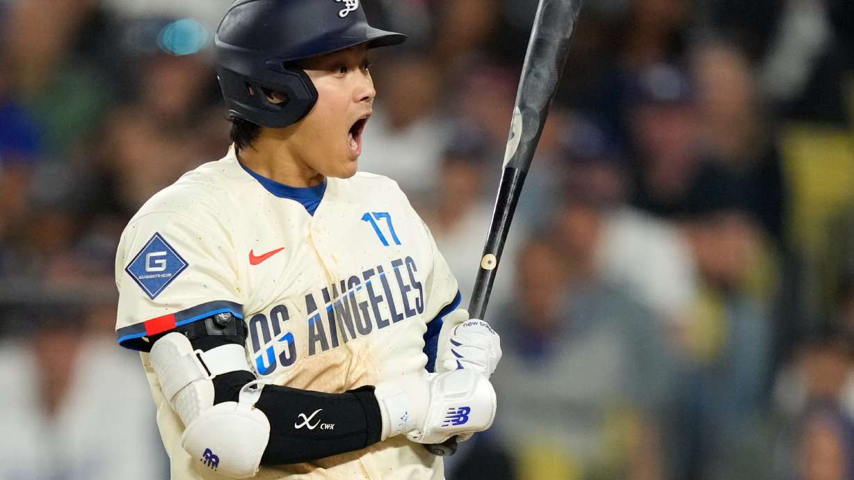 Los Angeles Dodgers' Shohei Ohtani reacts after a pitch was thrown in the dirt during the seventh inning of a baseball game against the Philadelphia Phillies, Saturday, May 30, 2026, in Los Angeles.