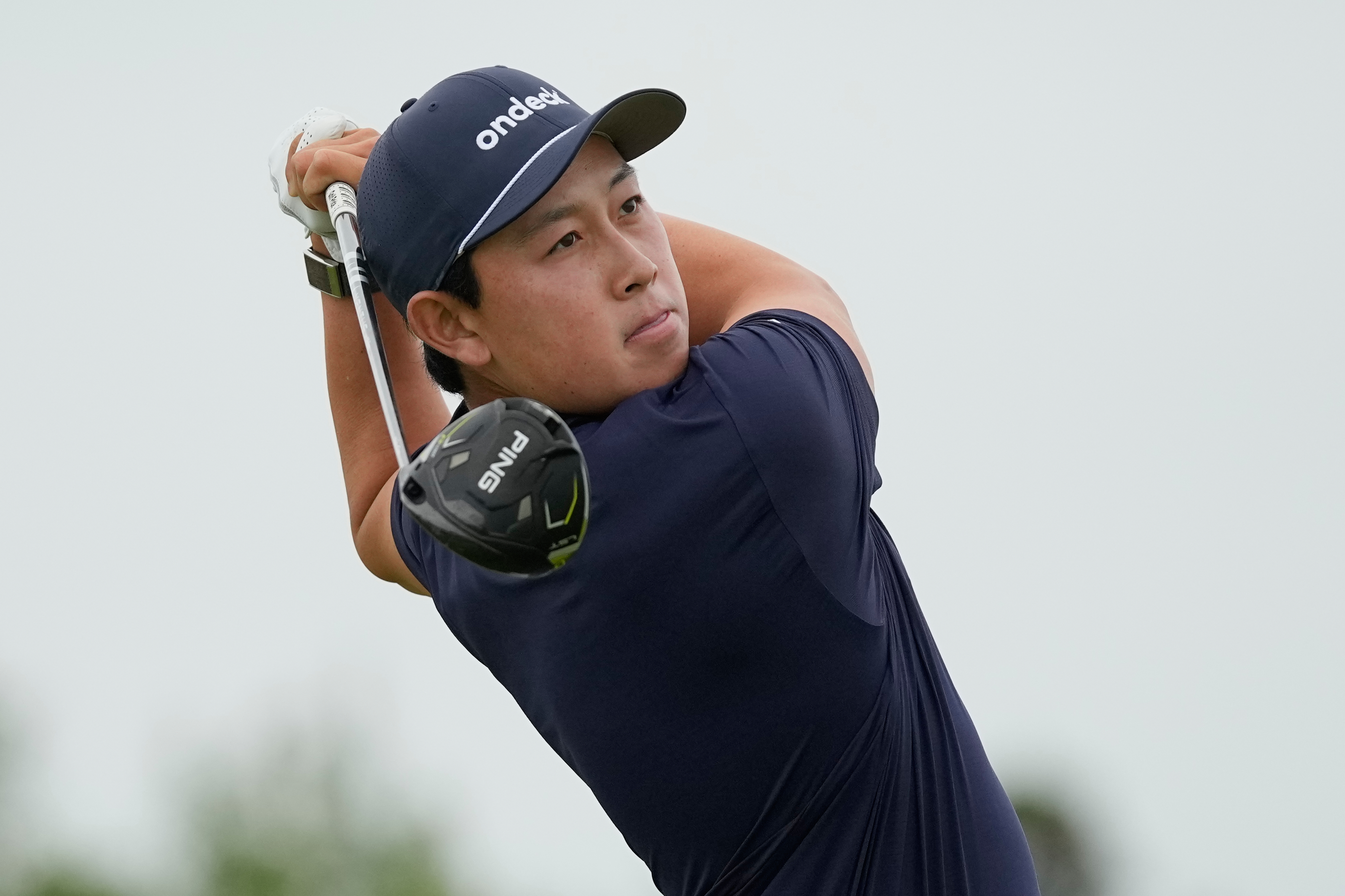 Dylan Wu watches his tee shot on the 13th hole during the first round of the U.S. Open golf tournament at Shinnecock Hills Golf Club in Southampton, N.Y., Thursday, June 18, 2026.