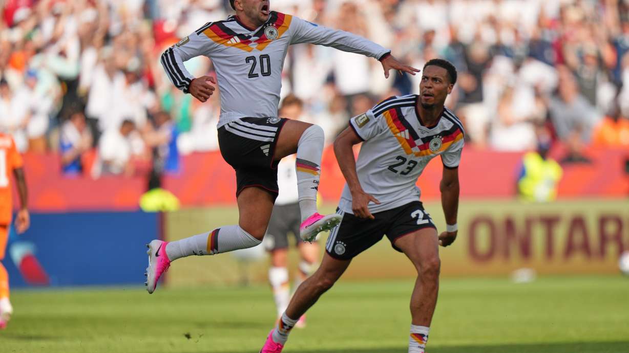 Germany's Nadiem Amiri leaps in the air as he celebrates after teammate Germany's Deniz Undav (26) scored their first goal during the World Cup Group E soccer match between Germany and Ivory Coast in Toronto, Saturday, June 20, 2026.