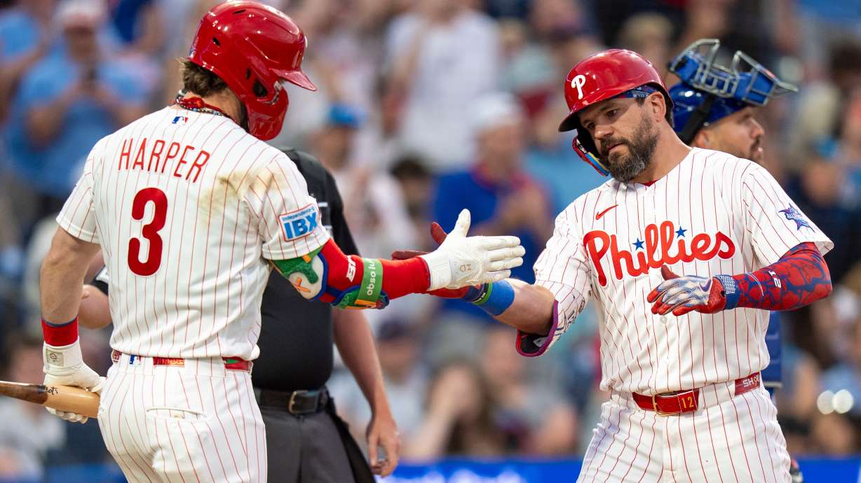 Philadelphia Phillies' Kyle Schwarber, front right, celebrates after his home run with Bryce Harper (3) during the third inning of a baseball game against the New York Mets, Saturday, June 20, 2026, in Philadelphia.