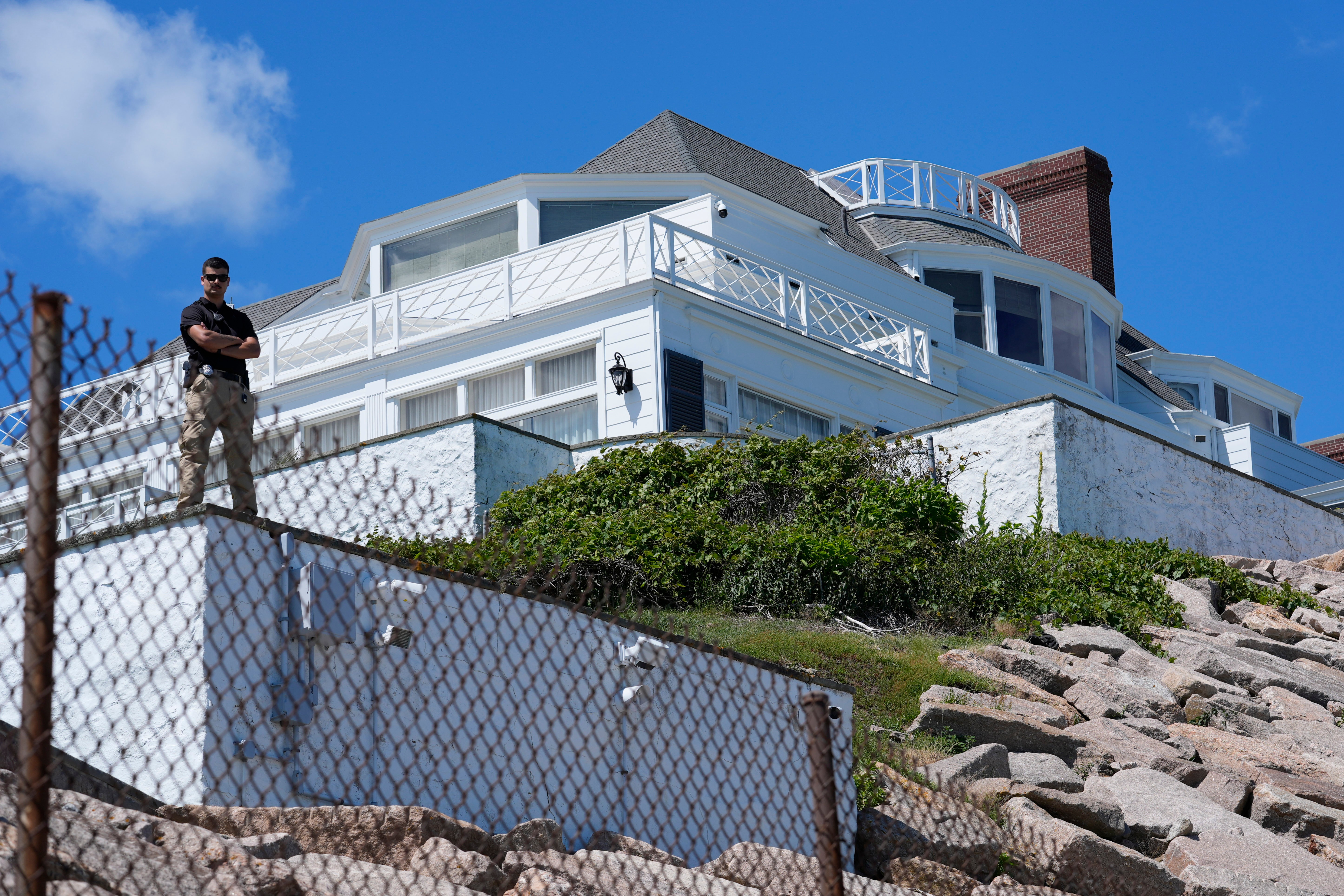 A security guard stands watch at Taylor Swift's "Holiday House," Saturday, June 20, 2026, in Westerly, R.I.