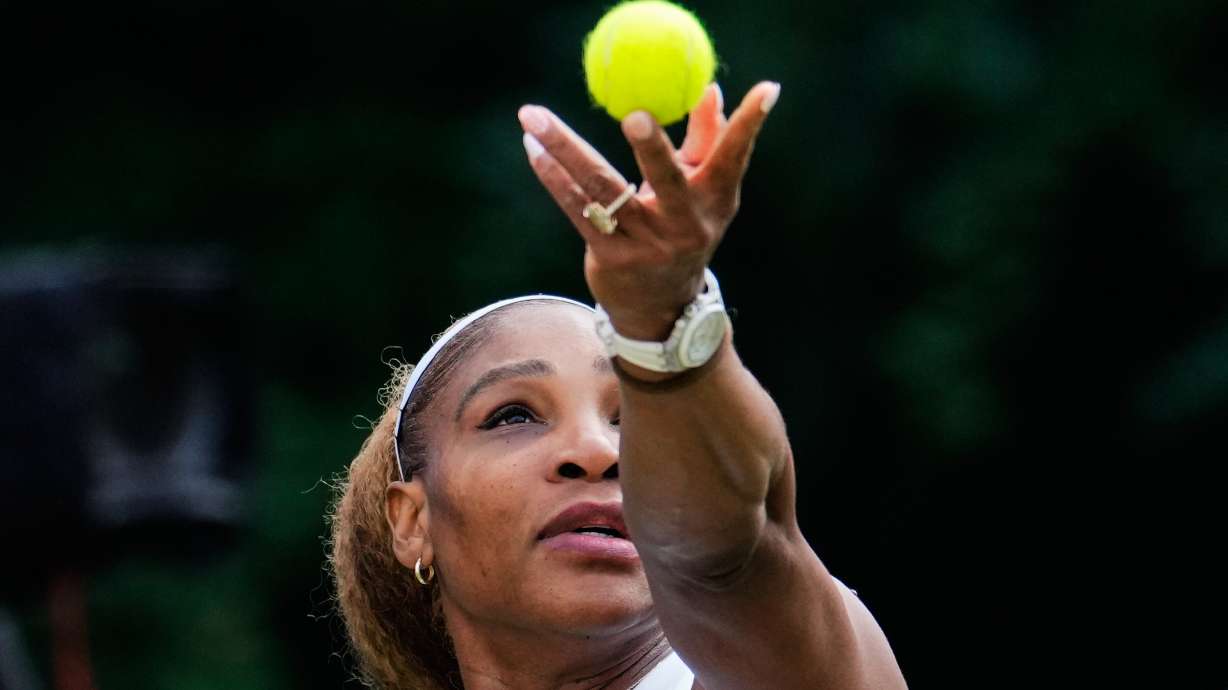 Serena Williams of the U.S. tosses the ball in the air to serve as she and Czech Republic's Karolina Muchova play during their round of 16 doubles match against New Zealand's Erin Routliffe and Mexico's Giuliana Olmo during the WTA 500 Berlin Open tennis tournament at Steffi Graf Stadium, in Berlin, Germany, Tuesday, June 16, 2026.