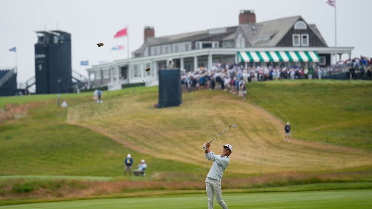 Miles Russell hits from the fairway on the first hole during the first round of the U.S. Open golf tournament at Shinnecock Hills Golf Club in Southampton, N.Y., Thursday, June 18, 2026.