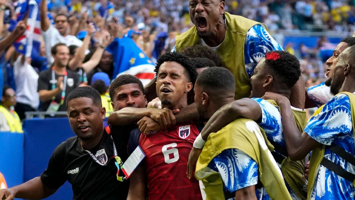 Cape Verde's Kevin Pina, center, celebrates with teammates after scoring the opening goal during the World Cup Group H soccer match between Uruguay and Cape Verde in Miami Gardens, Fla., Sunday, June 21, 2026.