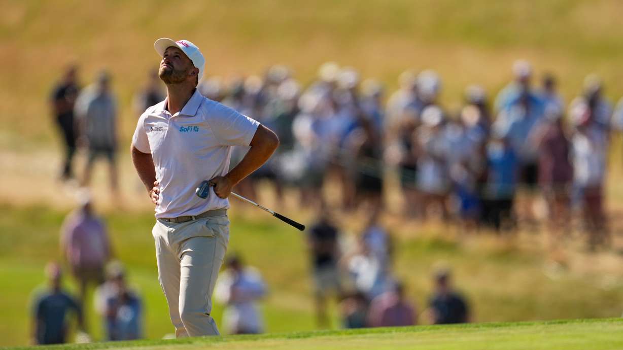 Wyndham Clark reacts to his shot on the ninth hole during the final round of the U.S. Open golf tournament at Shinnecock Hills Golf Club in Southampton, N.Y., Sunday, June 21, 2026.