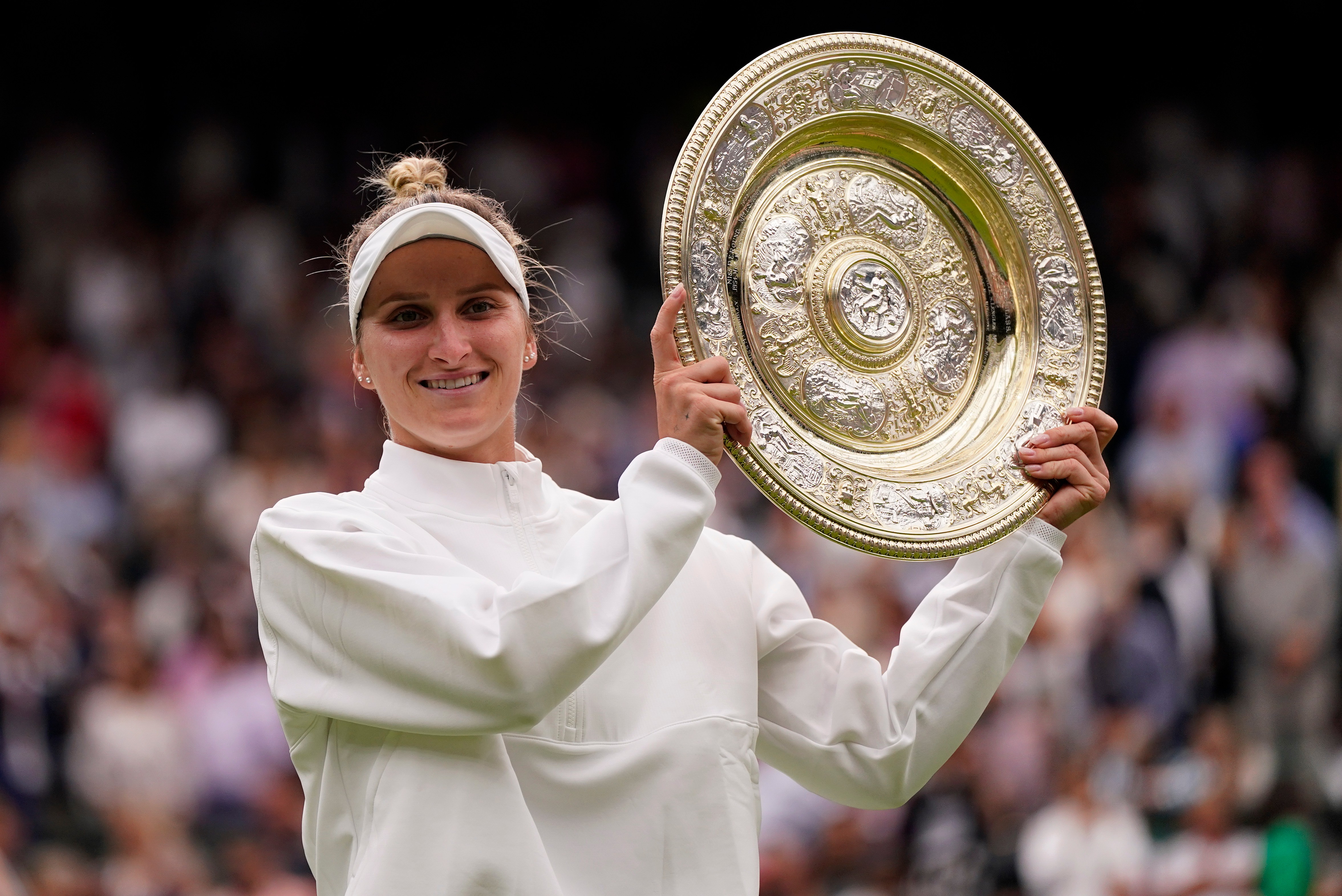 FILE - Czech Republic's Marketa Vondrousova celebrates with the trophy after beating Tunisia's Ons Jabeur to win the final of the women's singles on day thirteen of the Wimbledon tennis championships in London, Saturday, July 15, 2023. 