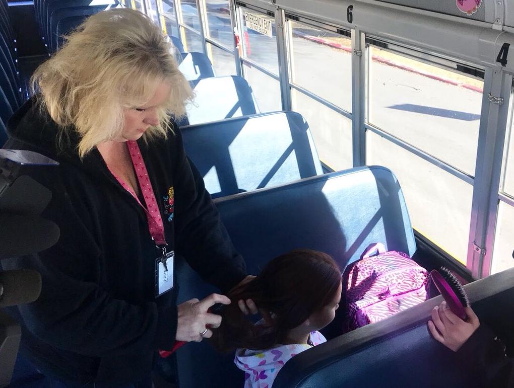 Bus driver turns into hair dresser for girls on bus