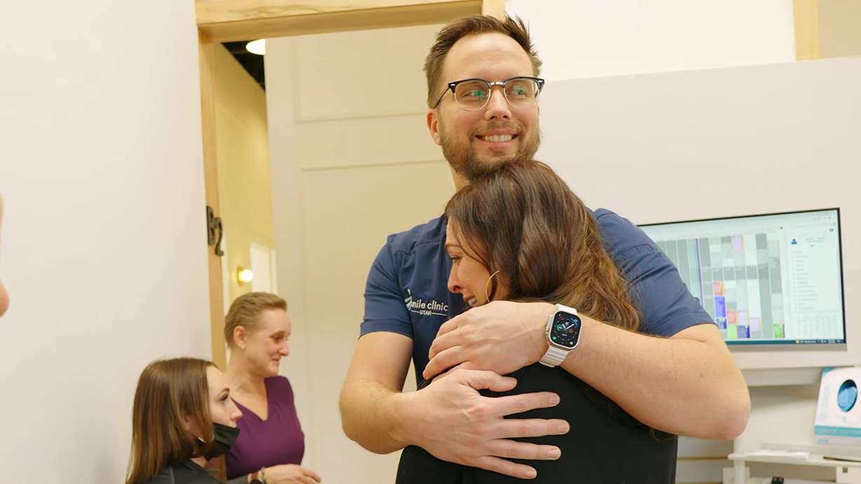 Dr. Randy Roberts of Smile Clinic with a grateful patient.