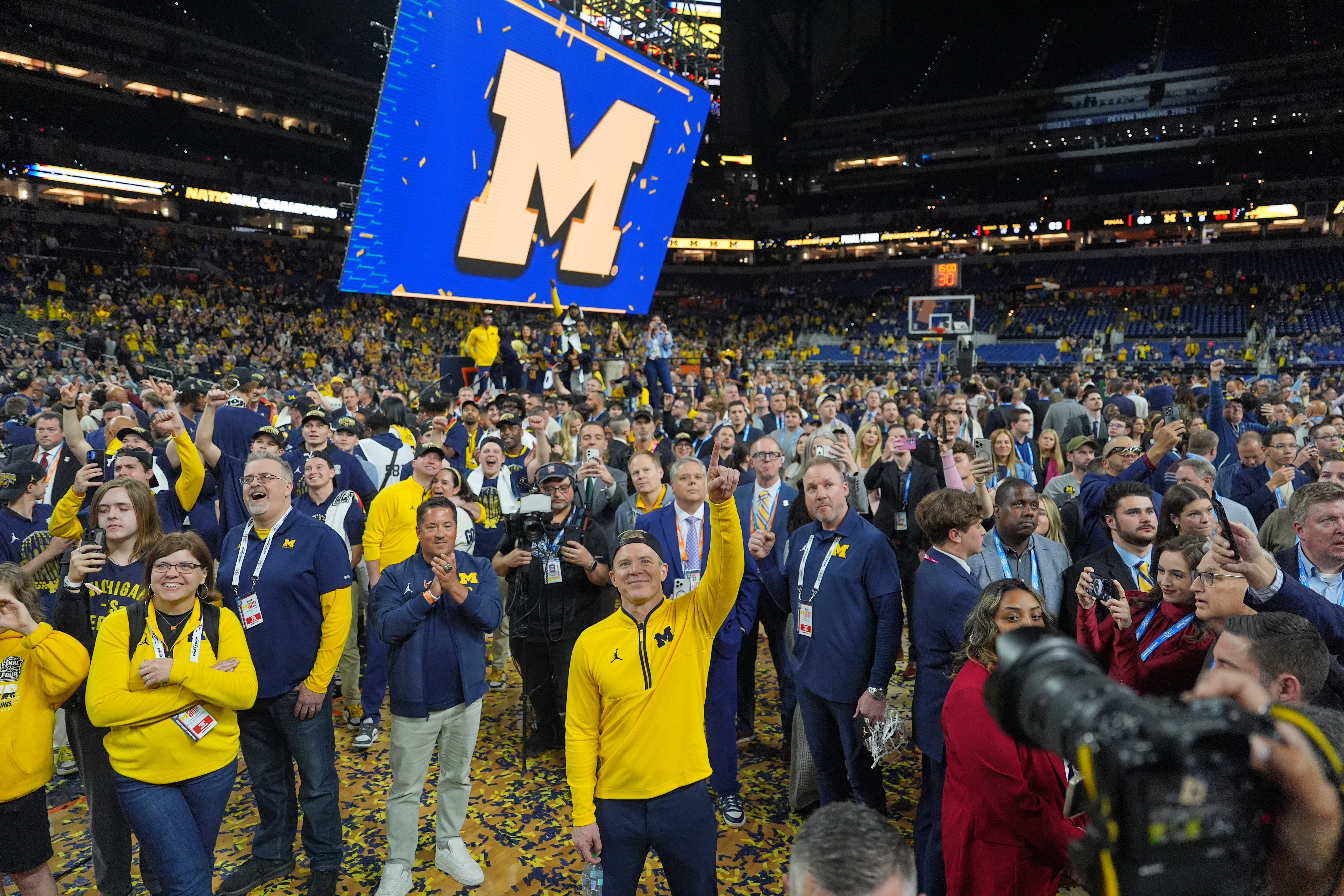 FILE - Michigan head coach Dusty May celebrates after defeating UConn in the NCAA college basketball tournament national championship game at the Final Four, April 7, 2026, in Indianapolis.