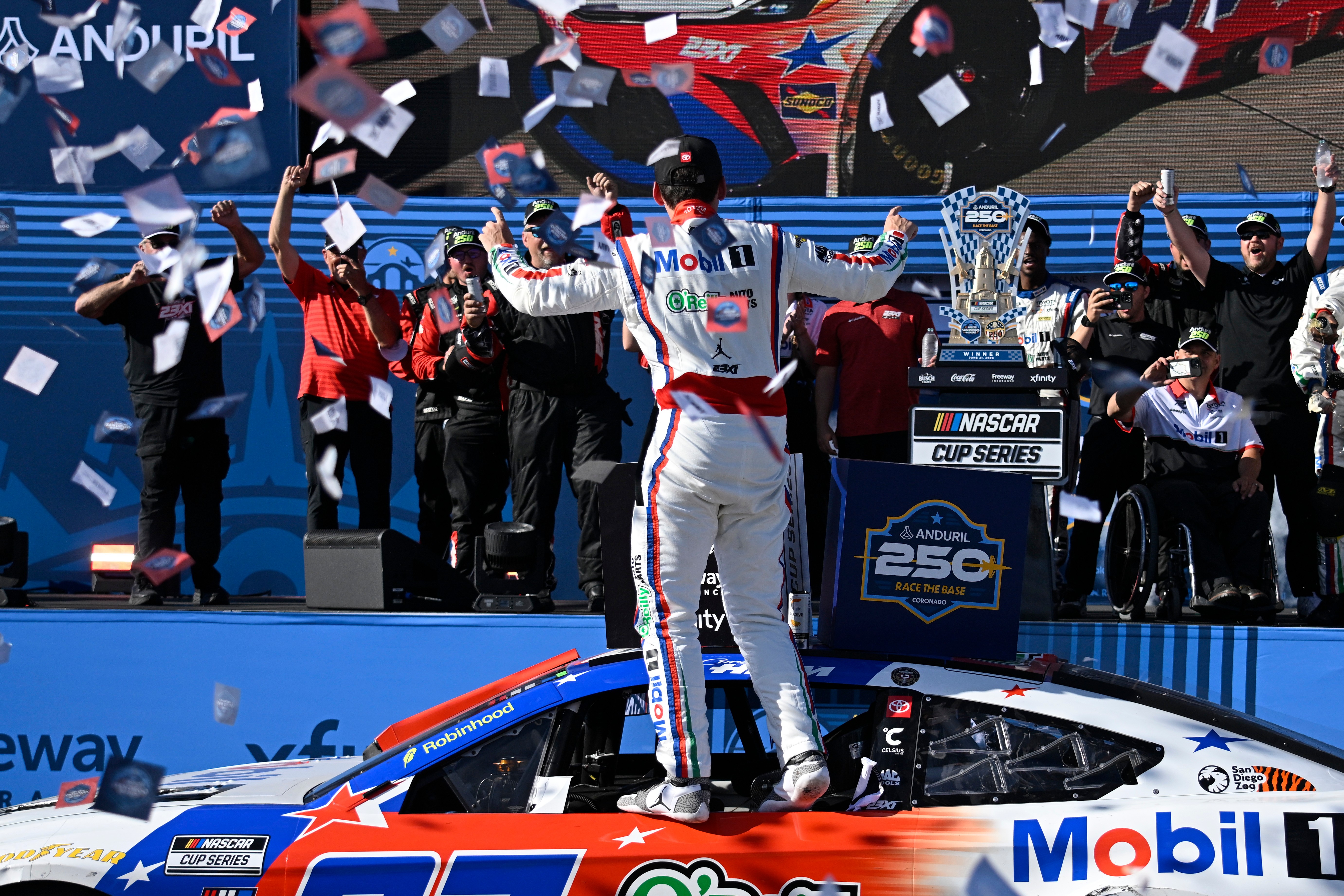 Cory Heim, center, celebrates in Victory Lane after winning a NASCAR Cup Series auto race, Sunday, June 21, 2026, in Coronado, Calif.