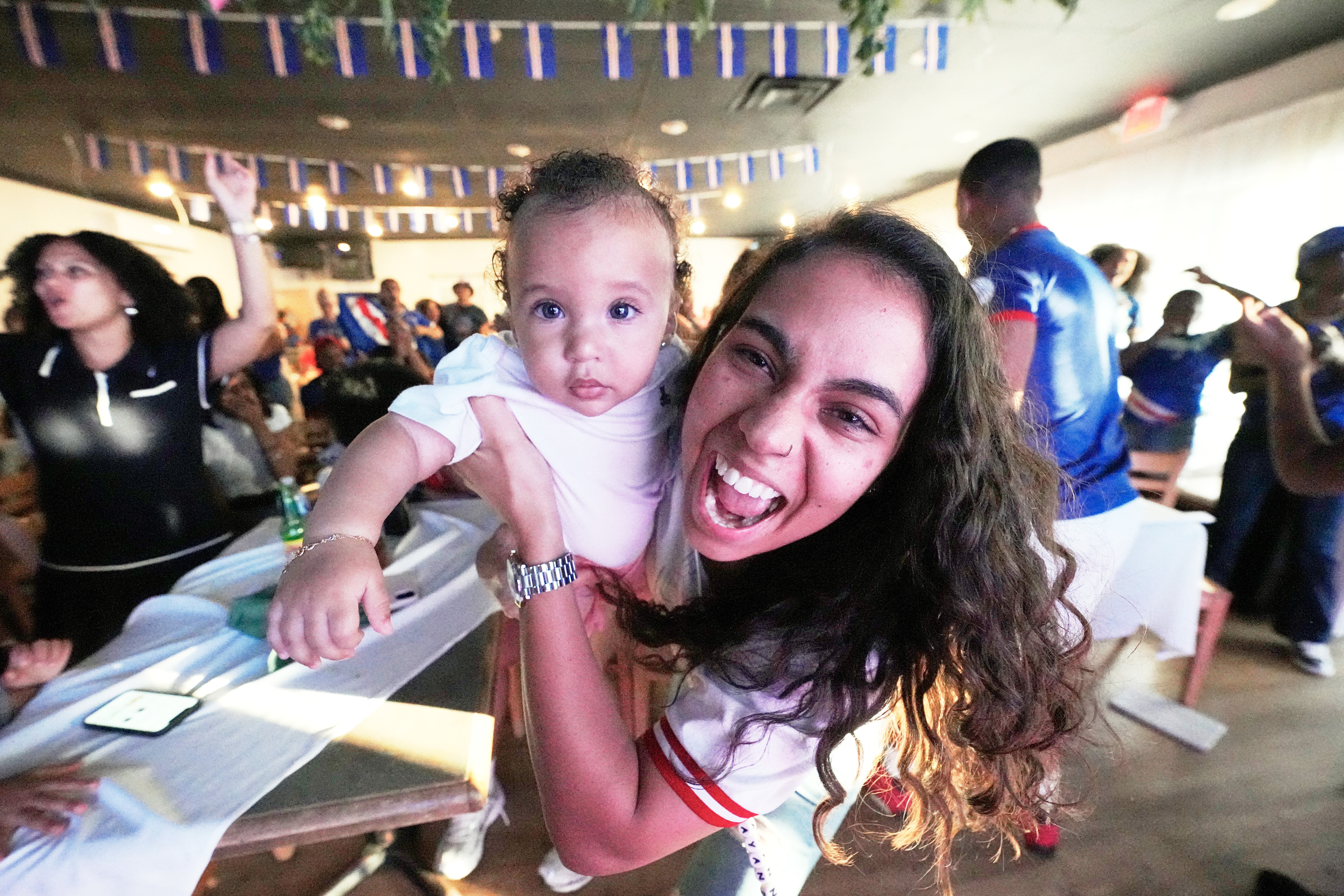 Cape Verde supporters celebrate their side's second goal as they watch the World Cup Group H soccer match between Uruguay and Cape Verde at a restaurant at a Cape Verde community in Brockton, Mass. near Boston, Sunday, June 21, 2026.