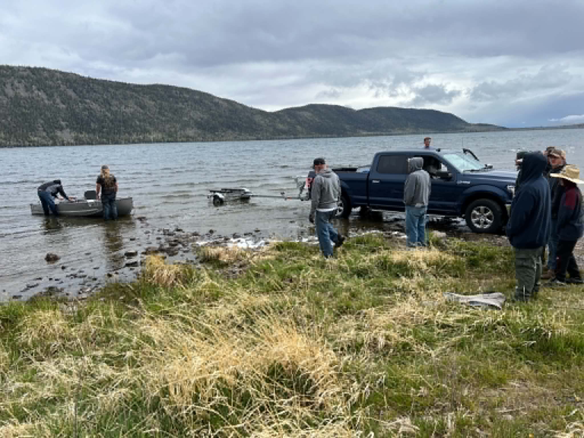 Crews recover the West family's fishing boat after it sank on May 29. The boat began to sink due to a sudden storm that flooded it. The family of seven all had life jackets on except for mother, Heather West, who swam her 3-year-old son to safety, nearly at the cost of her own life.