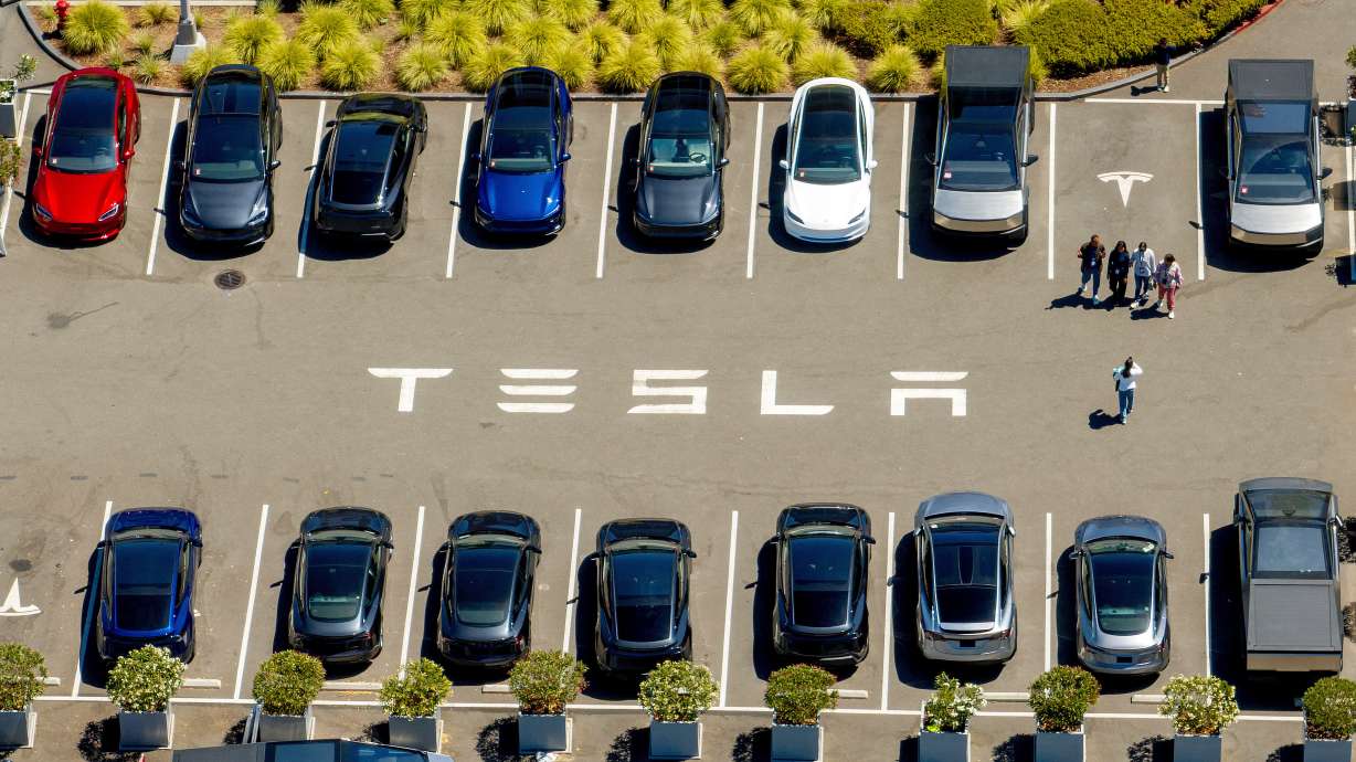 The top U.S. auto regulator opened an investigation Monday after a Tesla using an automated driving feature slammed into a Texas home at high speed and killed a 76-year-old woman standing inside.