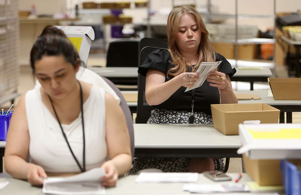 Madi Christensen, Salt Lake County Clerk’s Office and Elections Agency marketing and communications coordinator, sorts primary election ballots at the Salt Lake County Government Center in Salt Lake City on June 24, 2024. More changes could be coming to Utah's vote-by-mail system.