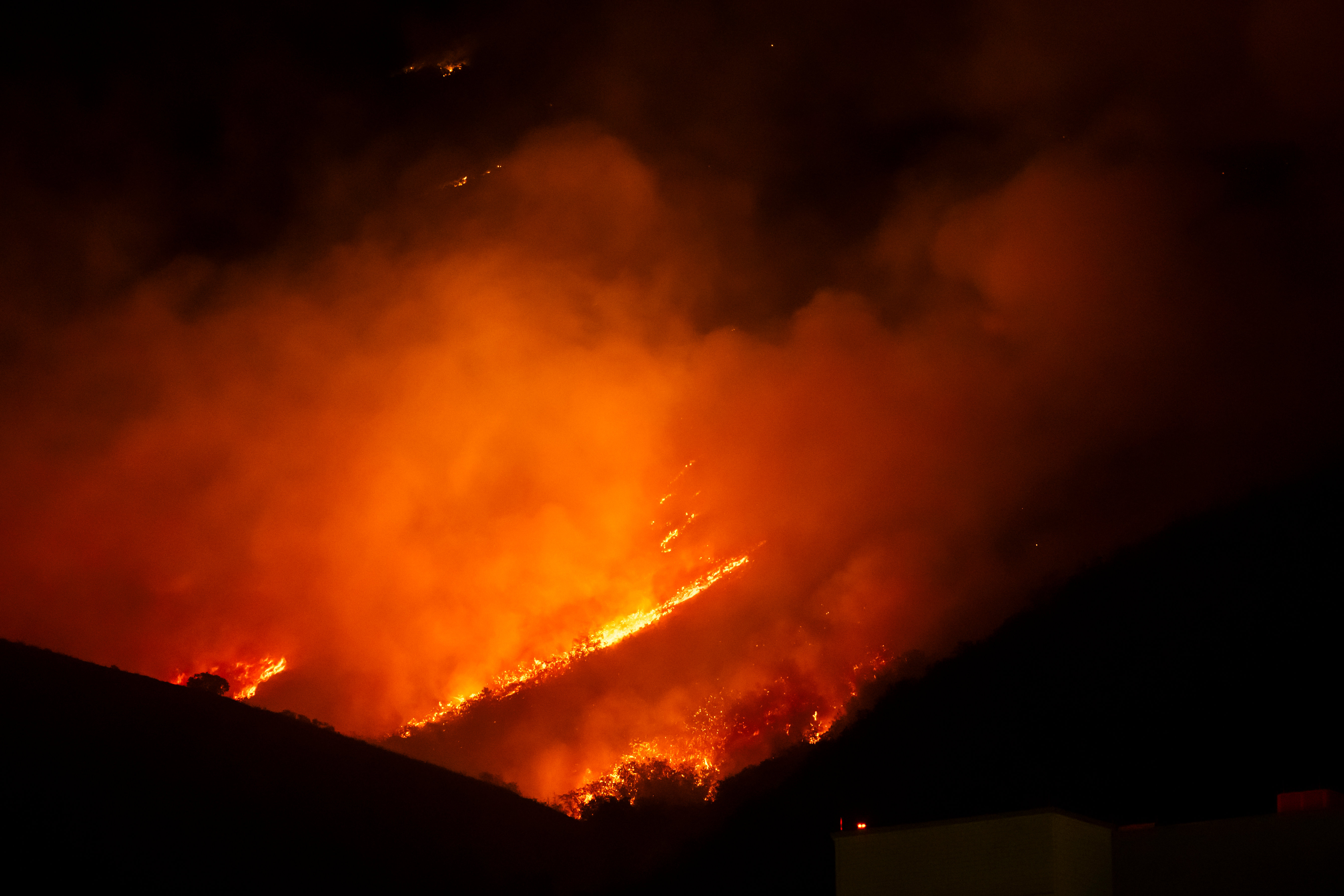 The Bonneville Fire burns above the University of Utah in Salt Lake City on Sunday. AccuWeather is predicting an active wildfire season this summer, with Utah in a high-risk region.