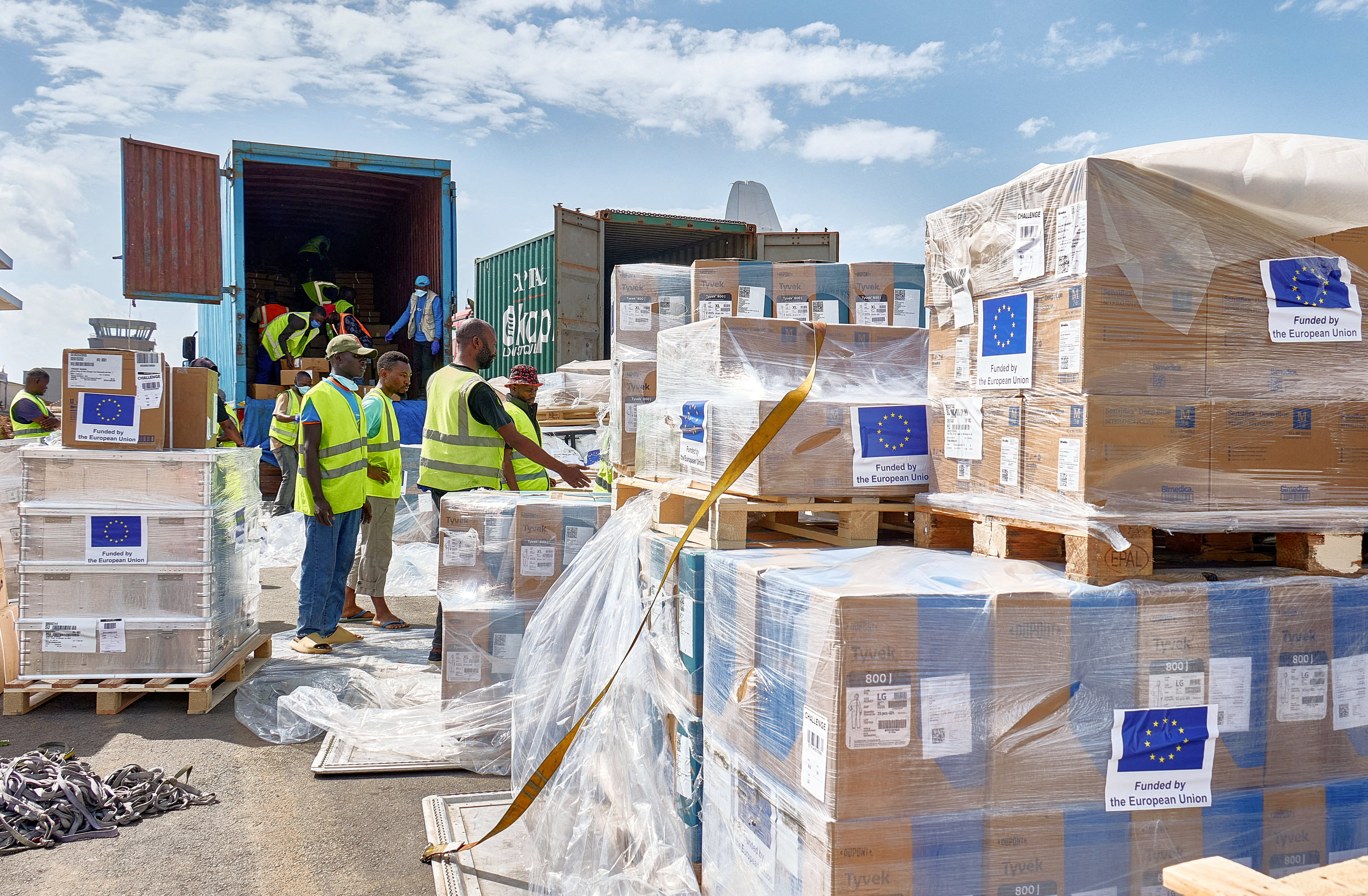 UNICEF staff and airport workers load trucks with aid for the Ebola outbreak at Bunia National Airport in Bunia, Democratic Republic of the Congo, May 28. The WHO said Tuesday the case count in the Congo reached the highest first-month total.