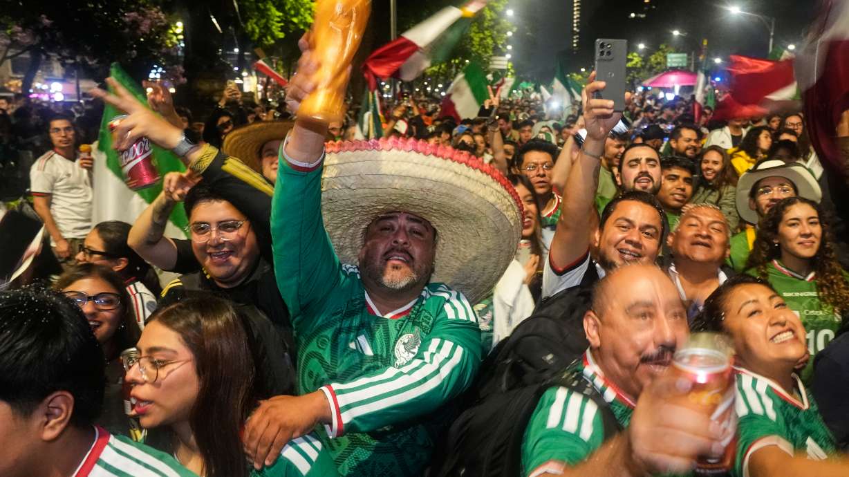 Mexican fans celebrate after beating South Korea during the World Cup Group A soccer match, at the Angel of Independence monument in Mexico City, Thursday, June 18, 2026.