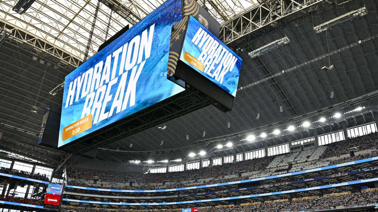 A hydration break takes place during the Argentina-Austria match at AT&T Stadium in Arlington, Texas, on Monday. Stadium DJs are at the center of hydration breaks to combat the loud boos it draws.
