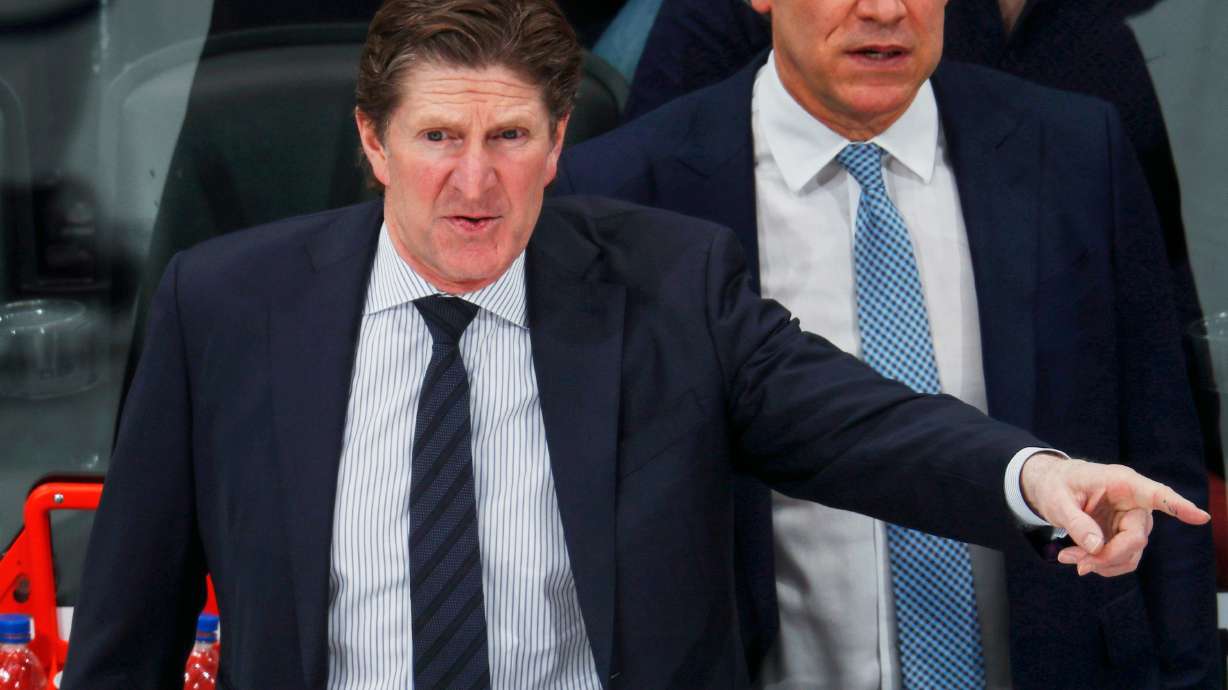 FILE - Toronto Maple Leafs head coach Mike Babcock directs his team against the Colorado Avalanche in the third period of an NHL hockey game, Feb. 12, 2019, in Denver.