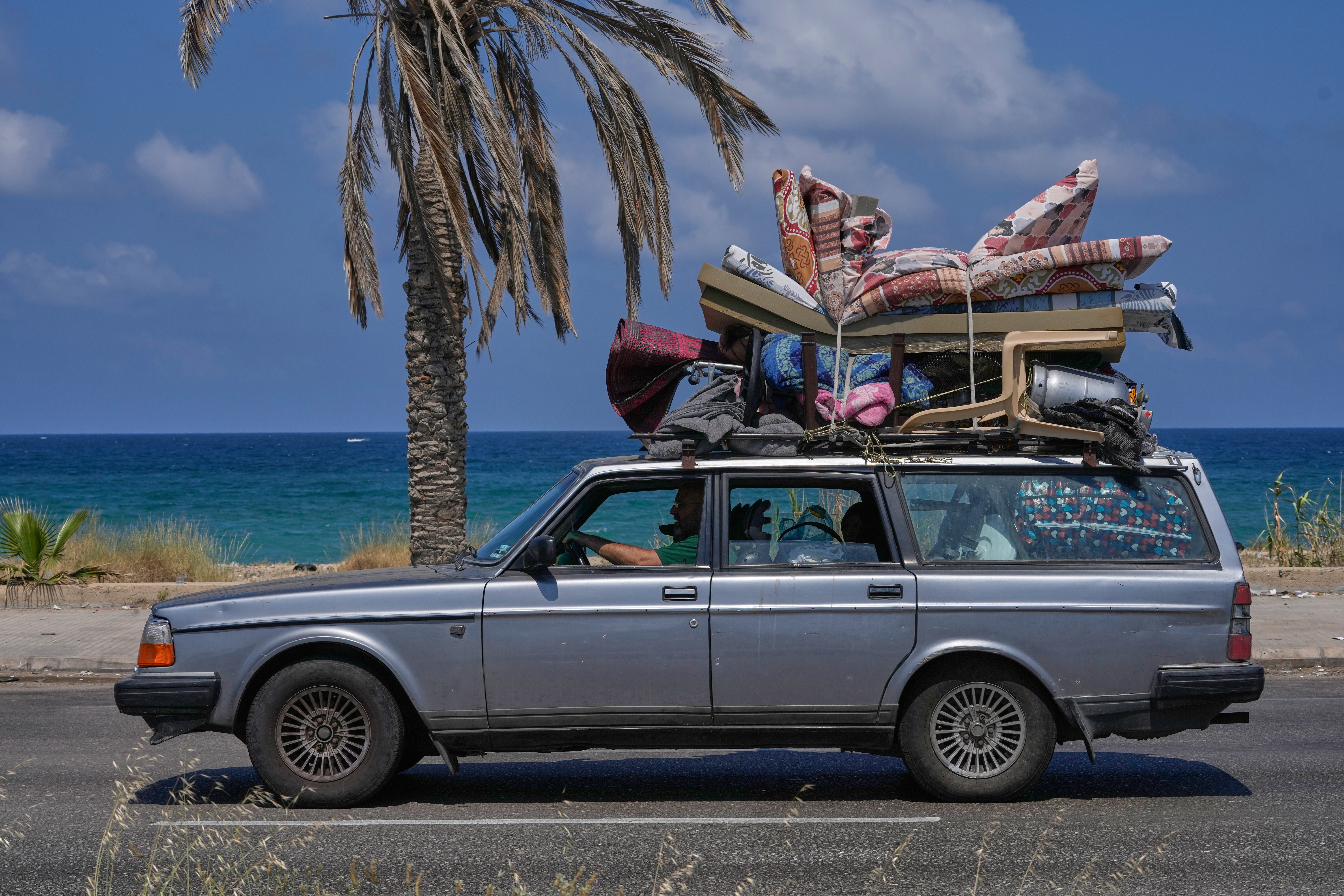 A displaced family with their belongings, return to their village following a ceasefire between Israel and Hezbollah in the southern port city of Sidon, Lebanon, Tuesday. Israeli Prime Minister Benjamin Netanyahu's comments raised new questions over the fragile ceasefire between Israel and Lebanon.