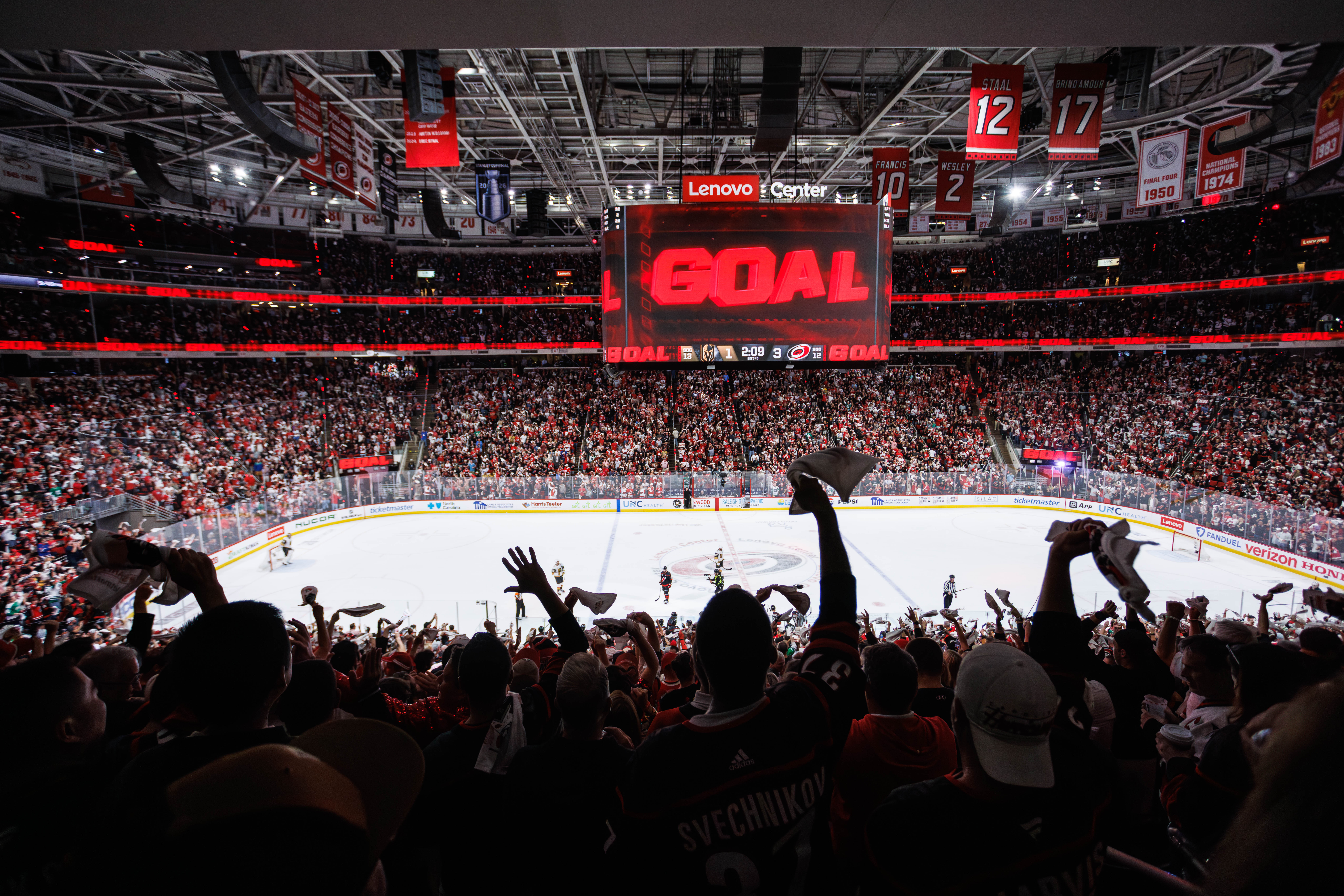 Carolina Hurricanes fans react after a goal against the Vegas Golden Knights during the second period of Game 5 of the NHL hockey Stanley Cup Final series in Raleigh, N.C., Thursday, June 11, 2026.
