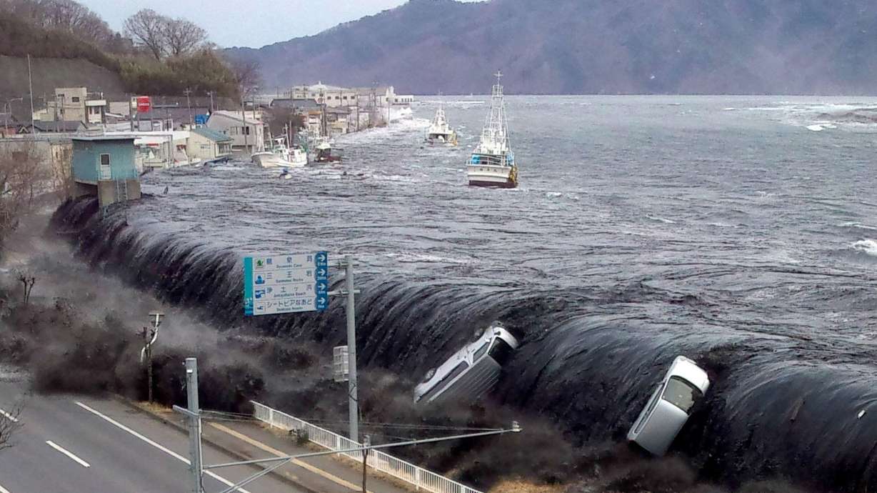 A tsunami wave breeches an embankment and flows into the city of Miyako, northern Japan, on March 11, 2011. The preceding 9.0-magnitude earthquake caused a small shift of Japan, setting off a chain reaction, scientists said in a new study.