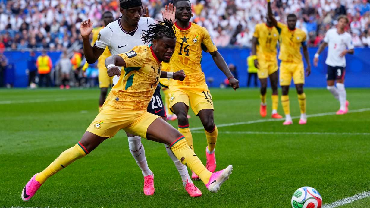 Ghana's Fatawu Issahaku (7) and England's Noni Madueke (20) battle for the ball during the World Cup Group L soccer match between England and Ghana in Foxborough, Mass., near Boston, Tuesday, June 23, 2026.