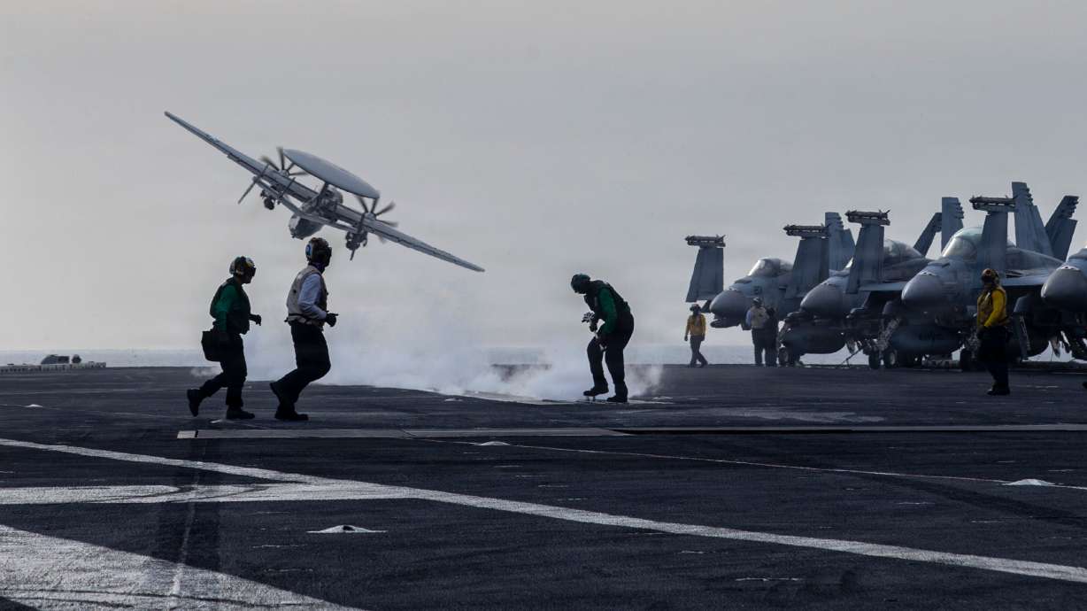 An E-2D Hawkeye, attached to Airborne Command Control Squadron 117, launches from the flight deck of Nimitz-class aircraft carrier USS Abraham Lincoln during Operation Epic Fury, March 31.