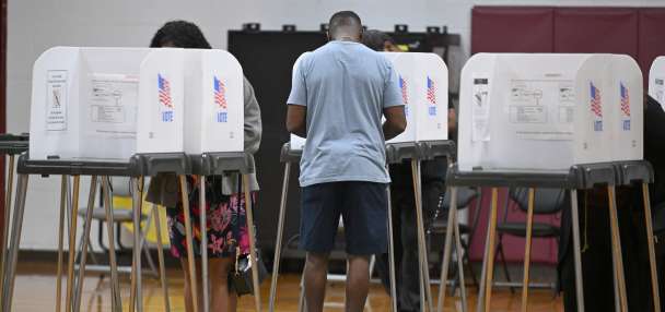 Federal judge bars Trump from implementing proof of citizenship requirement to vote