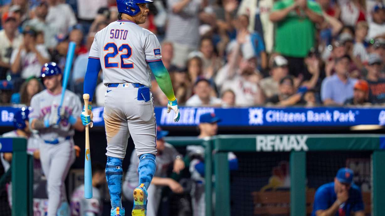 New York Mets' Juan Soto looks back after striking out during the eighth inning of a baseball game against the Philadelphia Phillies, Sunday, June 21, 2026, in Philadelphia.