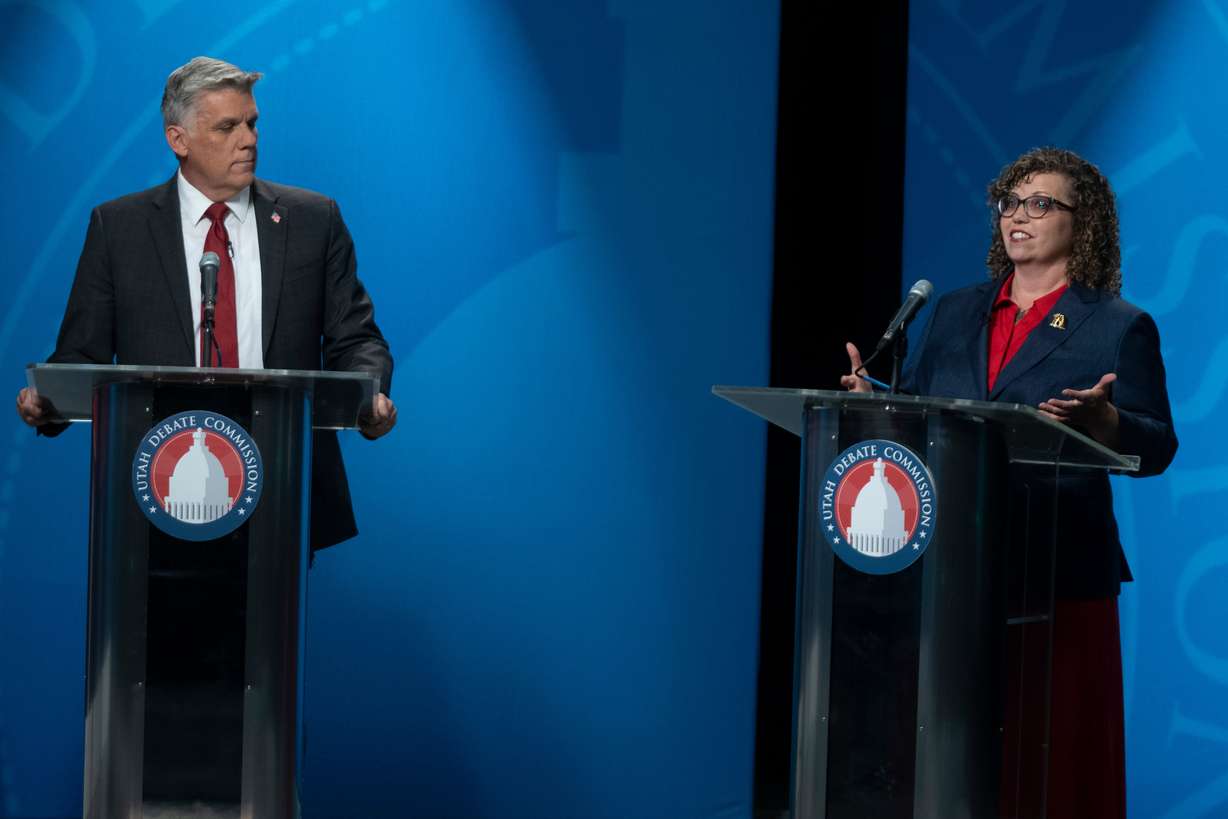 Phil Lyman watches as Celeste Maloy speaks during the 3rd Congressional District GOP primary debate in Salt Lake City on June 1. Maloy faced a stiff challenge from Lyman, who benefited on the campaign trail from name recognition.