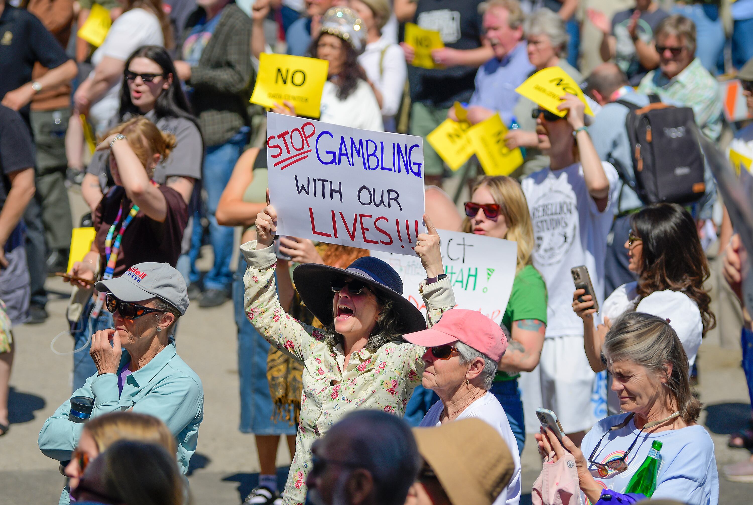 People gather to protest a data center outside the Box Elder County Commission meeting, May 4, in Tremonton. Rep. Celeste Maloy said it was important to not dodge the questions about the data center on the campaign trail.