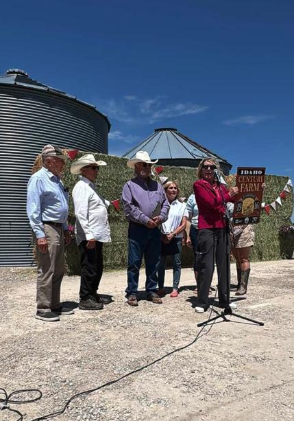 State official presenting Jeral Williams with the Idaho Century Farm award.