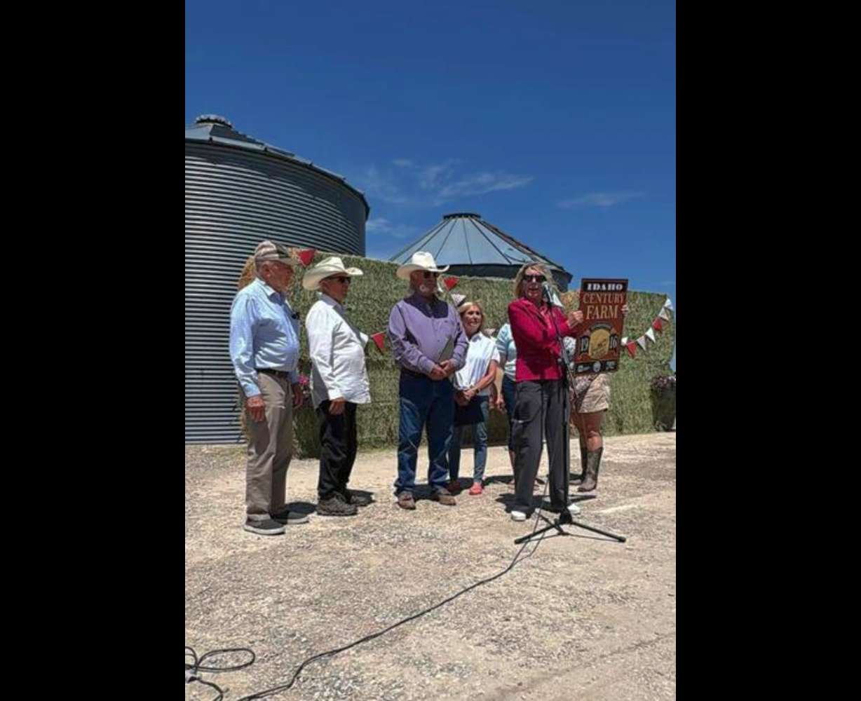 State official presenting Jeral Williams with the Idaho Century Farm award.