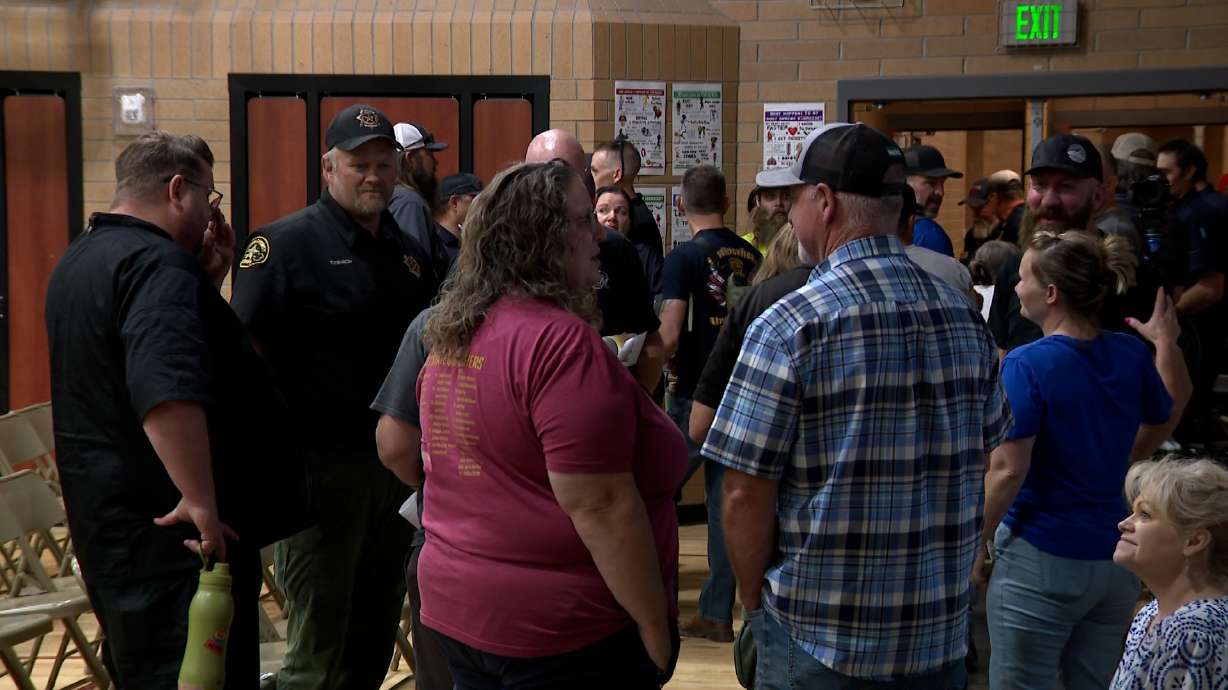 People attend a community meeting in Santaquin on Wednesday. Hundreds of Eureka residents displaced by the fast‑moving Iron Fire will be allowed to return home Thursday at noon, officials announced.