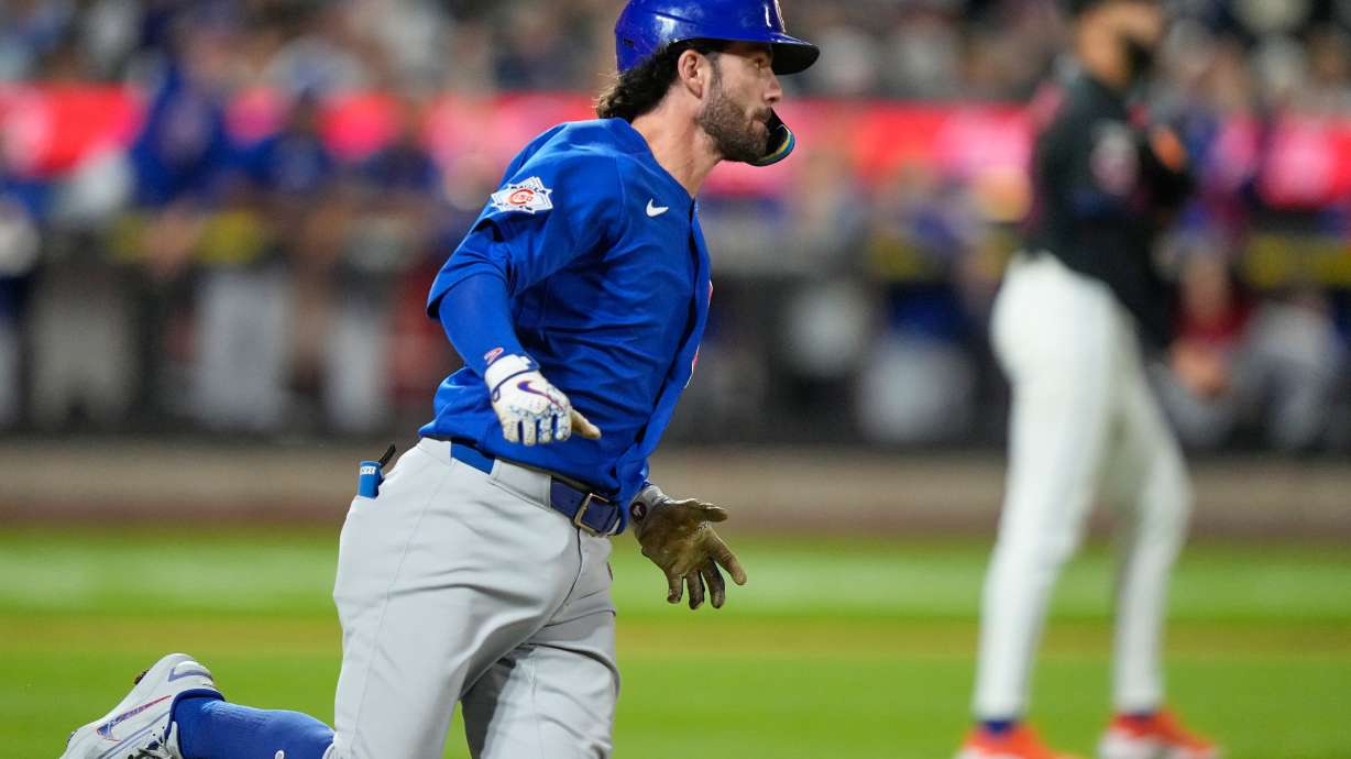 Chicago Cubs' Dansby Swanson runs to first base for a two-run single during the ninth inning in the second baseball game of a doubleheader against the Chicago Cubs Wednesday, June 24, 2026, in New York.