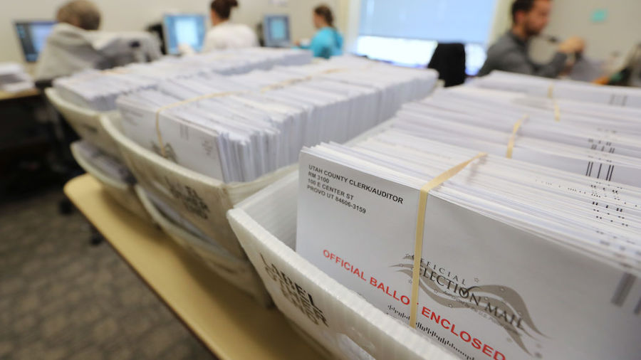 FILE - Thousands of ballots sit in boxes as Utah County election workers process the mail-in ballots for the midterm elections on November 6, 2018 in Provo, Utah. Utah early voting has been highest ever in Utah's midterm elections. One of the main proportions on the ballet in Utah is whether Utah will legalize medical marijuana. 