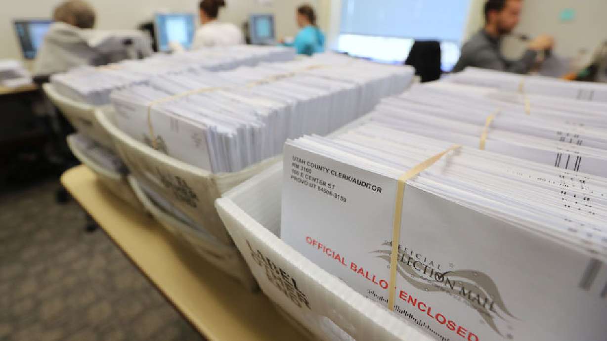 FILE - Thousands of ballots sit in boxes as Utah County election workers process the mail-in ballots for the midterm elections on November 6, 2018 in Provo, Utah. Utah early voting has been highest ever in Utah's midterm elections. One of the main proportions on the ballet in Utah is whether Utah will legalize medical marijuana.