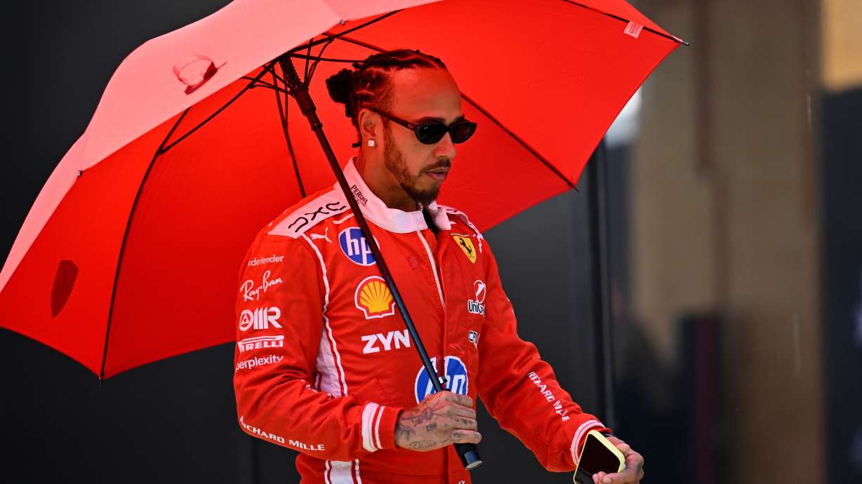 Ferrari driver Lewis Hamilton of Britain walks through the paddock ahead of the Austrian F1 Grand Prix, in Spielberg, Austria, Thursday, June 25, 2026.
