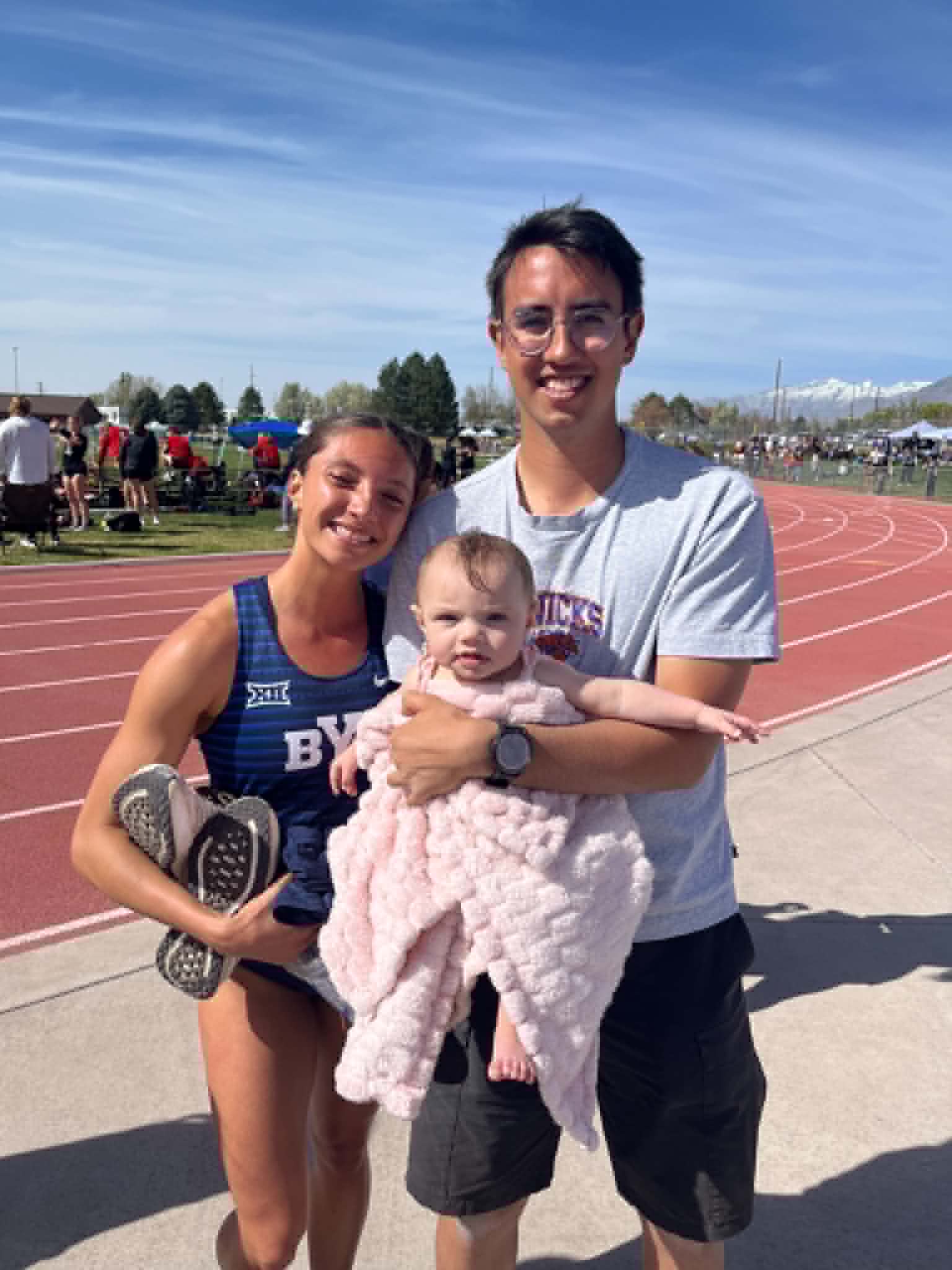 Krystie Solomon-Jensen poses with husband Jace Jensen after running a personal best 800 meters of 2:01.40 at the 2026 NCAA Division I Outdoor Track & Field Championships on June 13. The BYU runner ran that time just nine months after giving birth.