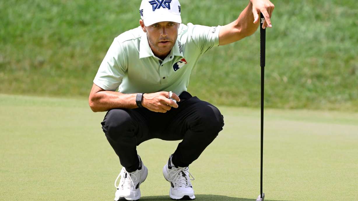 Eric Cole lines up his putt on the 18th green during the first round of the Travelers Championship golf tournament at TPC River Highlands, Thursday, June 25, 2026, in Cromwell, Conn.