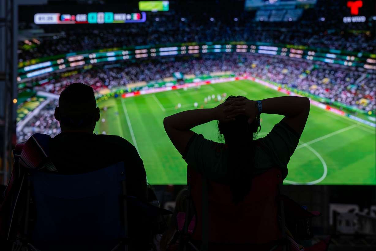 Soccer fans at Millcreek Common watch Mexico and the Czech Republic play in the World Cup on Wednesday. Despite over half of Utahns saying they would watch at least one match of the World Cup, 39% said they wouldn't watch any.