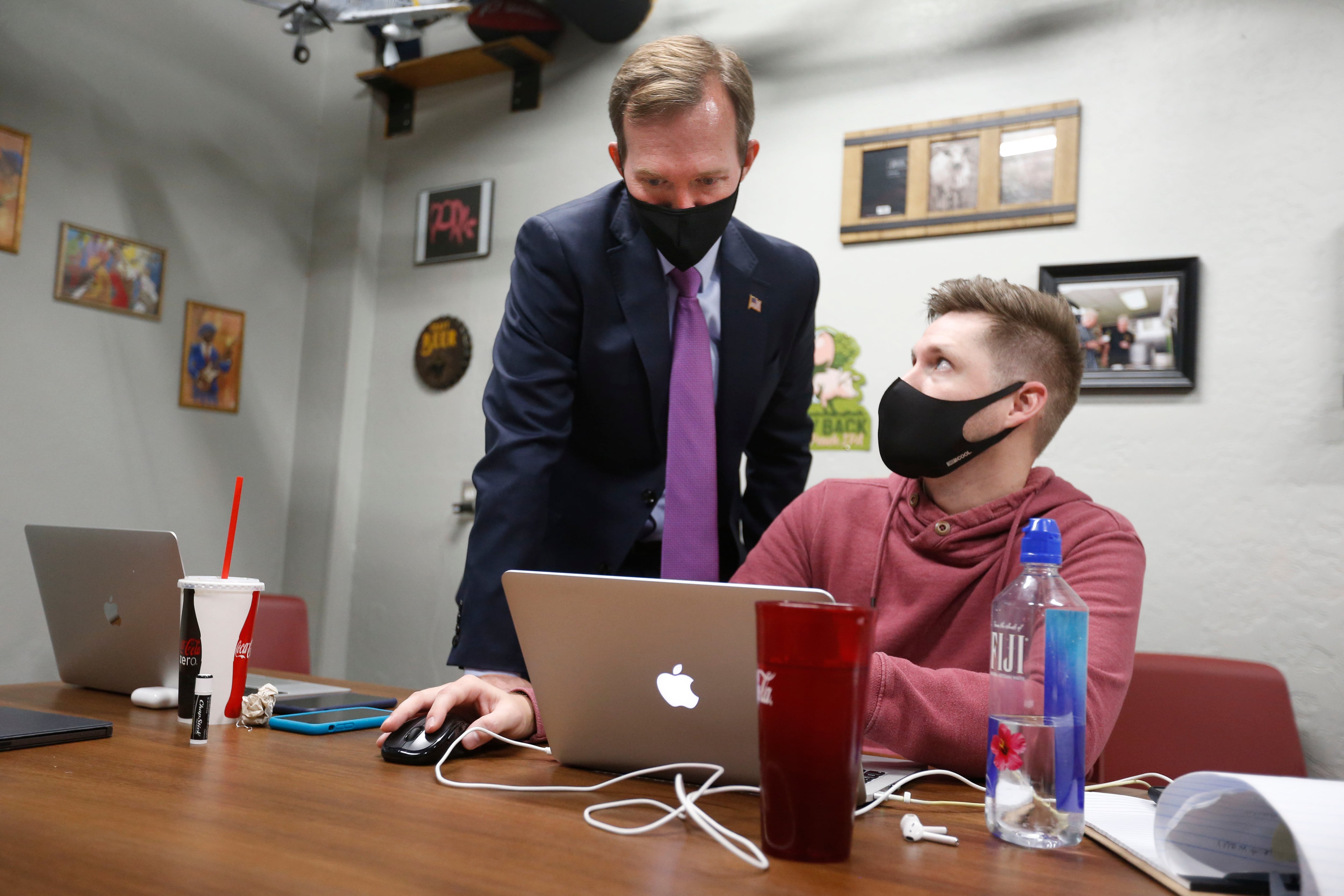 Then-Rep. Ben McAdams and his campaign manager, Andrew Roberts, look at election results at Pat’s Barbecue in Salt Lake City on election night, Nov. 3, 2020. McAdams said he feels more urgency than in his first term in Congress as his return continues to look likely.