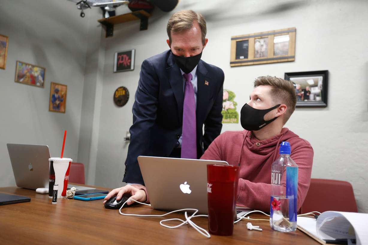 Then-Rep. Ben McAdams and his campaign manager, Andrew Roberts, look at election results at Pat’s Barbecue in Salt Lake City on election night, Nov. 3, 2020. McAdams said he feels more urgency than in his first term in Congress as his return continues to look likely.