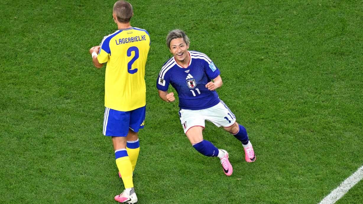 Japan's Daizen Maeda, right, celebrates after scoring their opening goal during the World Cup Group F soccer match between Japan and Sweden in Arlington, Texas, near Dallas, Thursday, June 25, 2026.