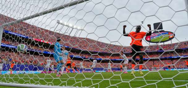 Brian Brobbey and the Dutch roll in the rain to a 3-1 win over Tunisia to top World Cup Group F