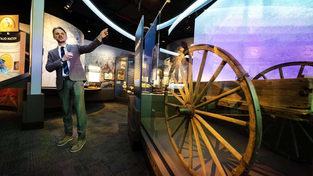 Museum Director Tim Glenn shows an original pioneer handcart as he gives a tour of the Museum of Utah in Salt Lake City on Monday. The museum is operated by the Utah Historical Society and is Utah’s first dedicated state history museum.