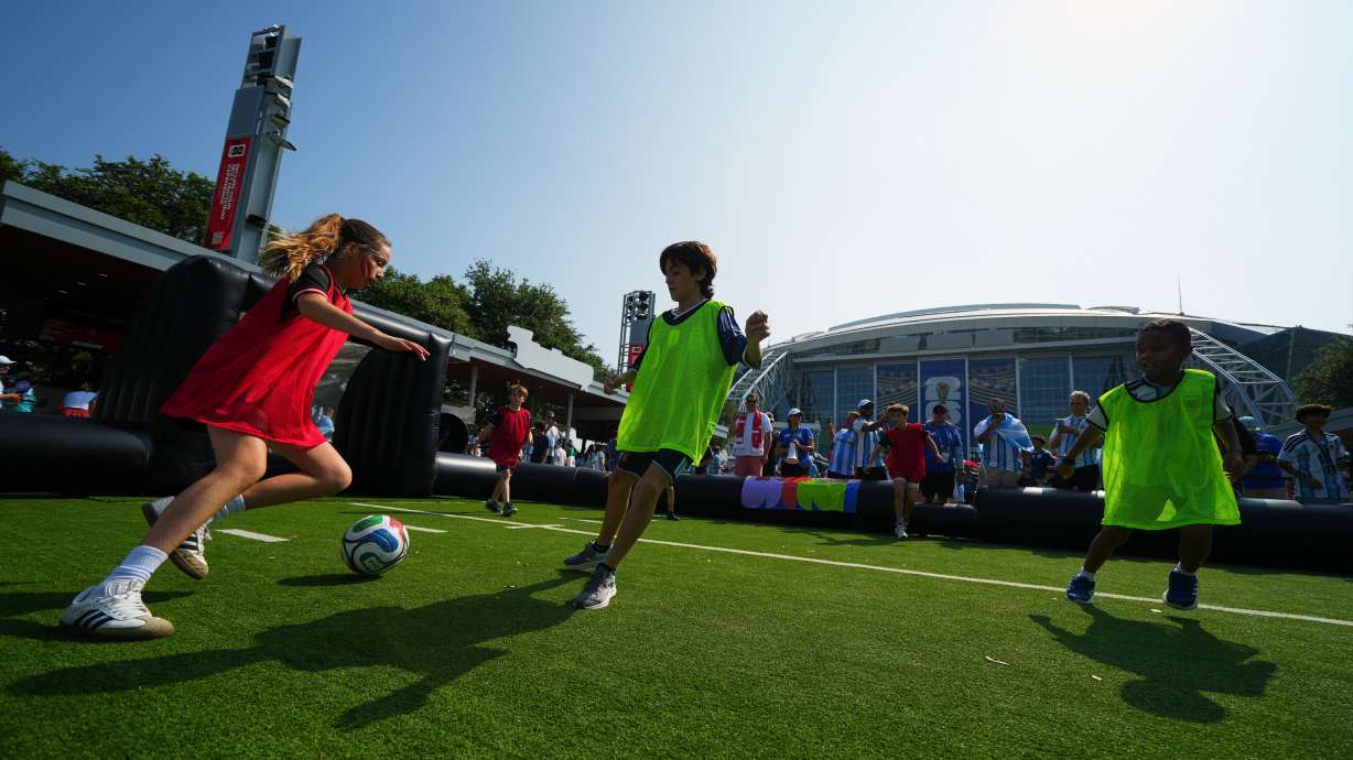 FILE - Children wearing shirts of Austria and Argentina play soccer outside the stadium before the World Cup Group J soccer match between Argentina and Austria in Arlington, Texas, near Dallas, Monday, June 22, 2026.